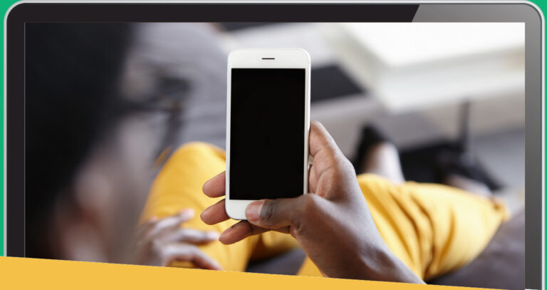 A woman is holding a cell phone
